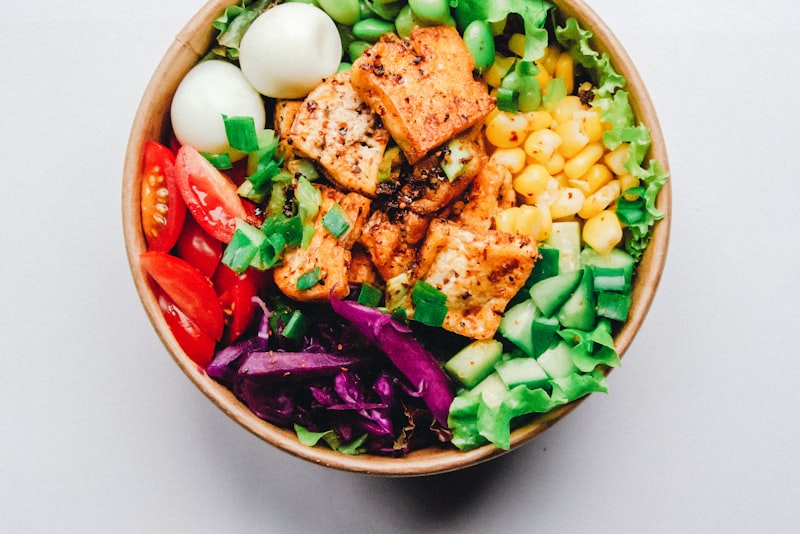 A golden pan-seared chicken breast resting on a cutting board